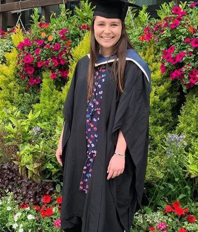 Megan Ramsay wearing the graduation coat and hat